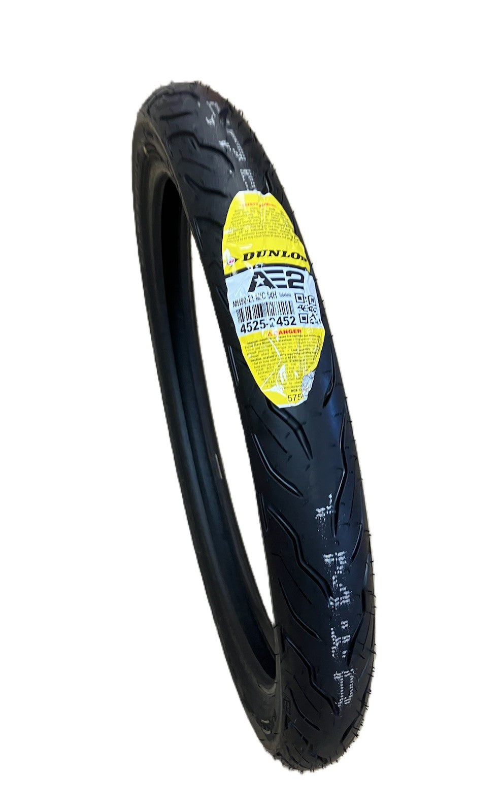 Black tire with Dunlop branding on a white background